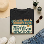 T‑Shirt — "Loaves, Fish & Budget Cuts: Miracles Don’t Cover Inflation"