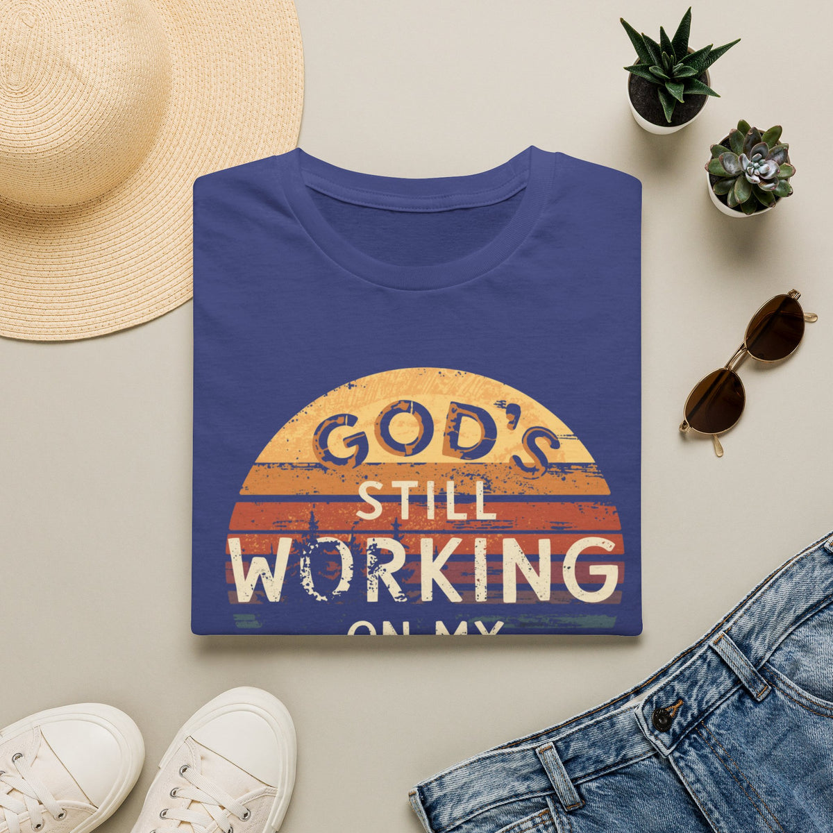 Christian T-Shirt — "God’s Still Working on My Attitude" Retro Sun Graphic